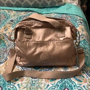 Rose gold / Metallic Kipling bag.